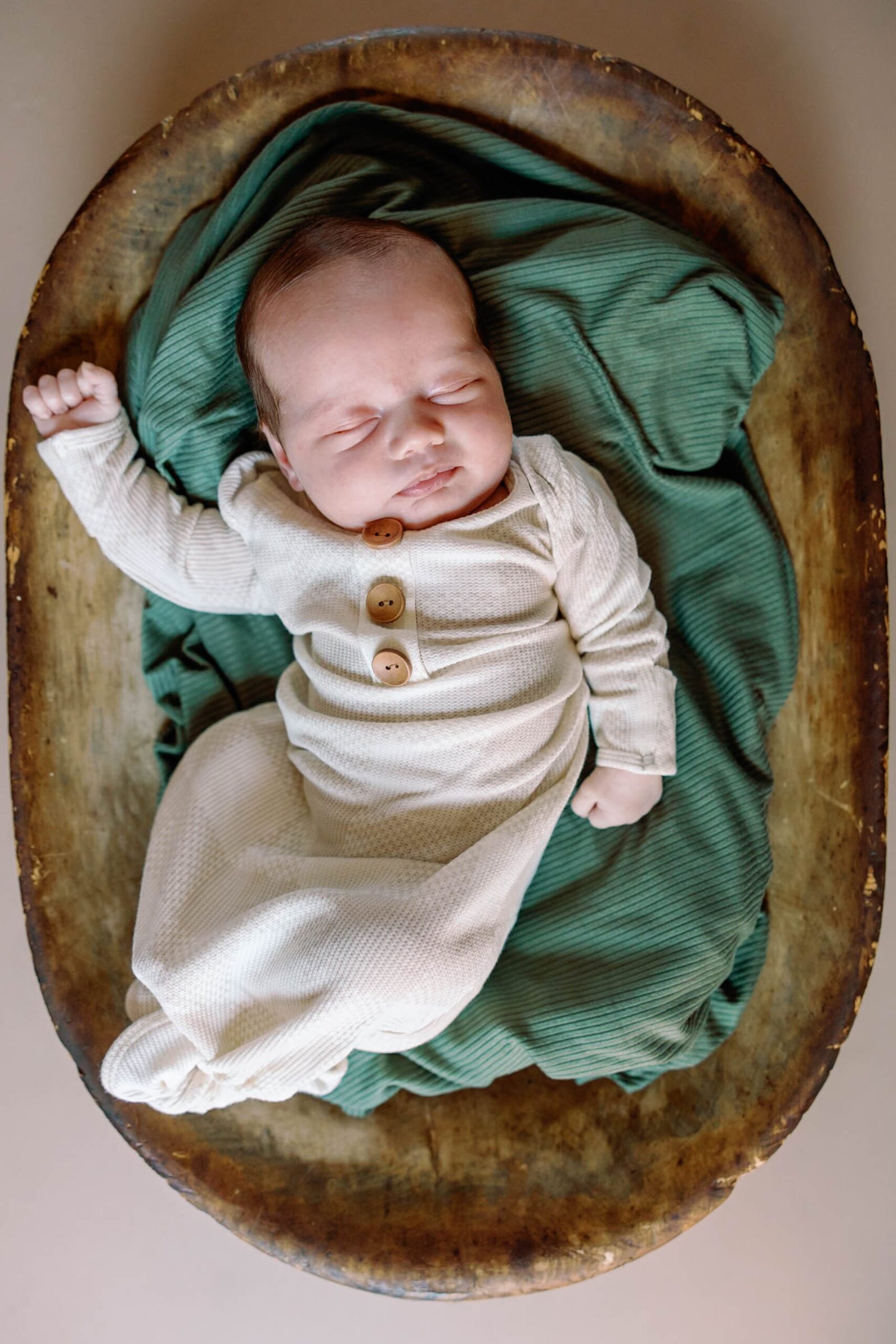 newborn baby boy in a bowl