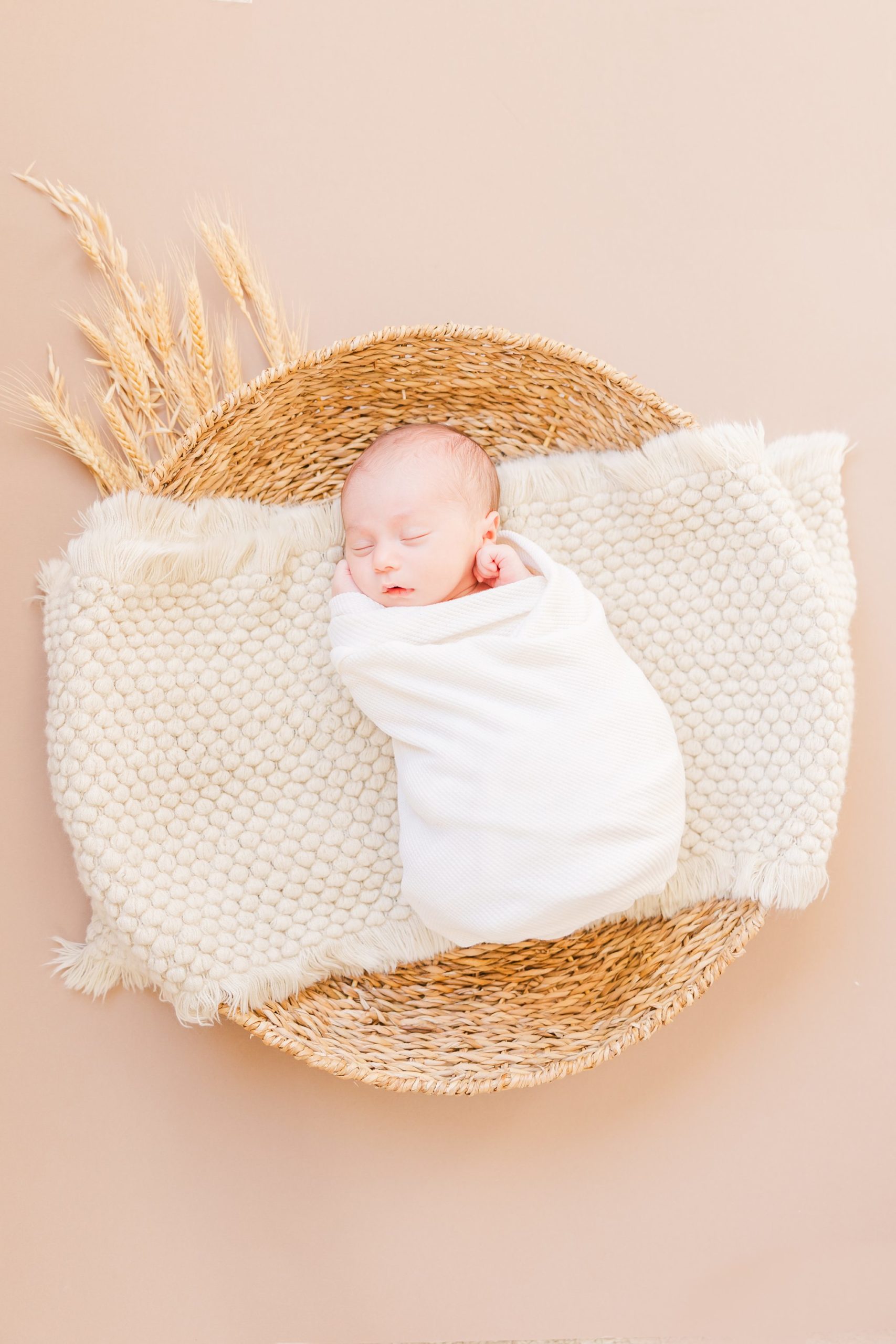 newborn on a basket